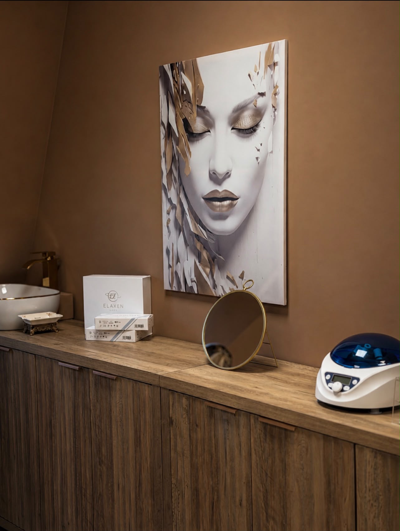 Counter with basin, products and artwork