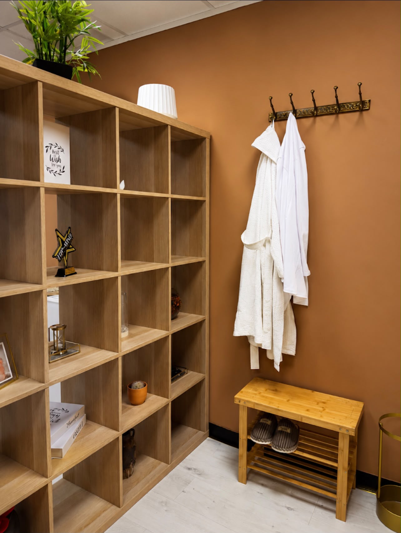 Changing area with shelving, robes and slippers